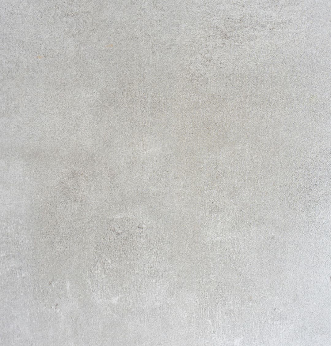 A grey stone-like wallpaper featuring a textured pattern.